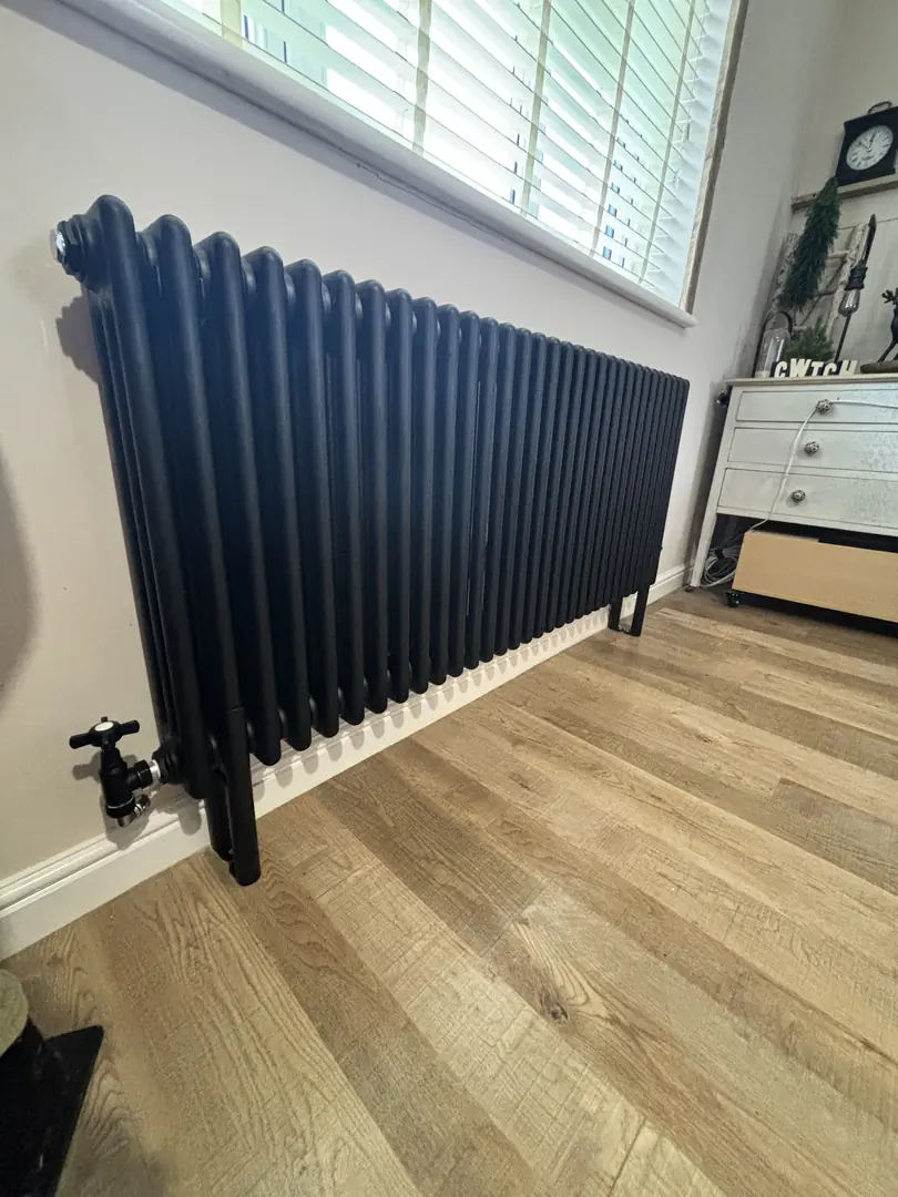 Column radiator installation fitted under window in a Cardiff property