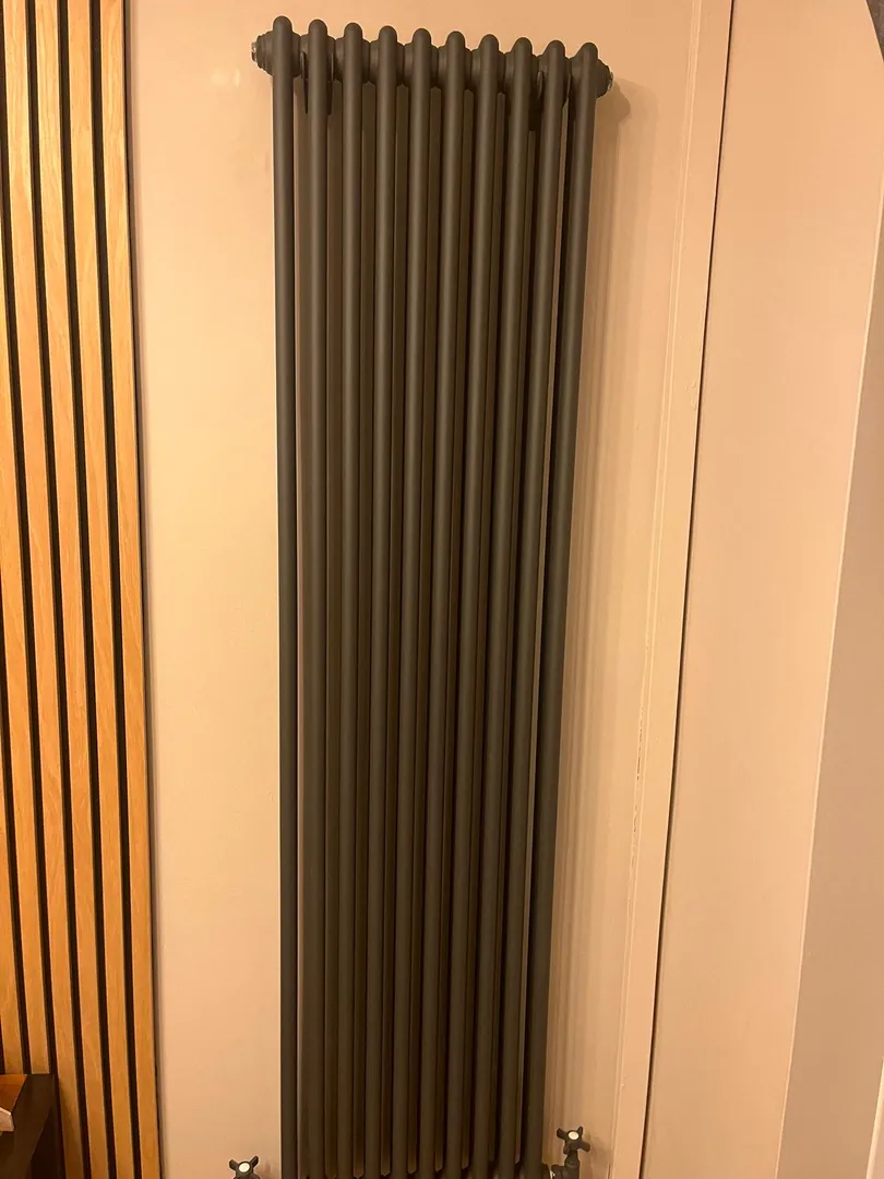 Vertical radiator installation by plumber in Porthcawl