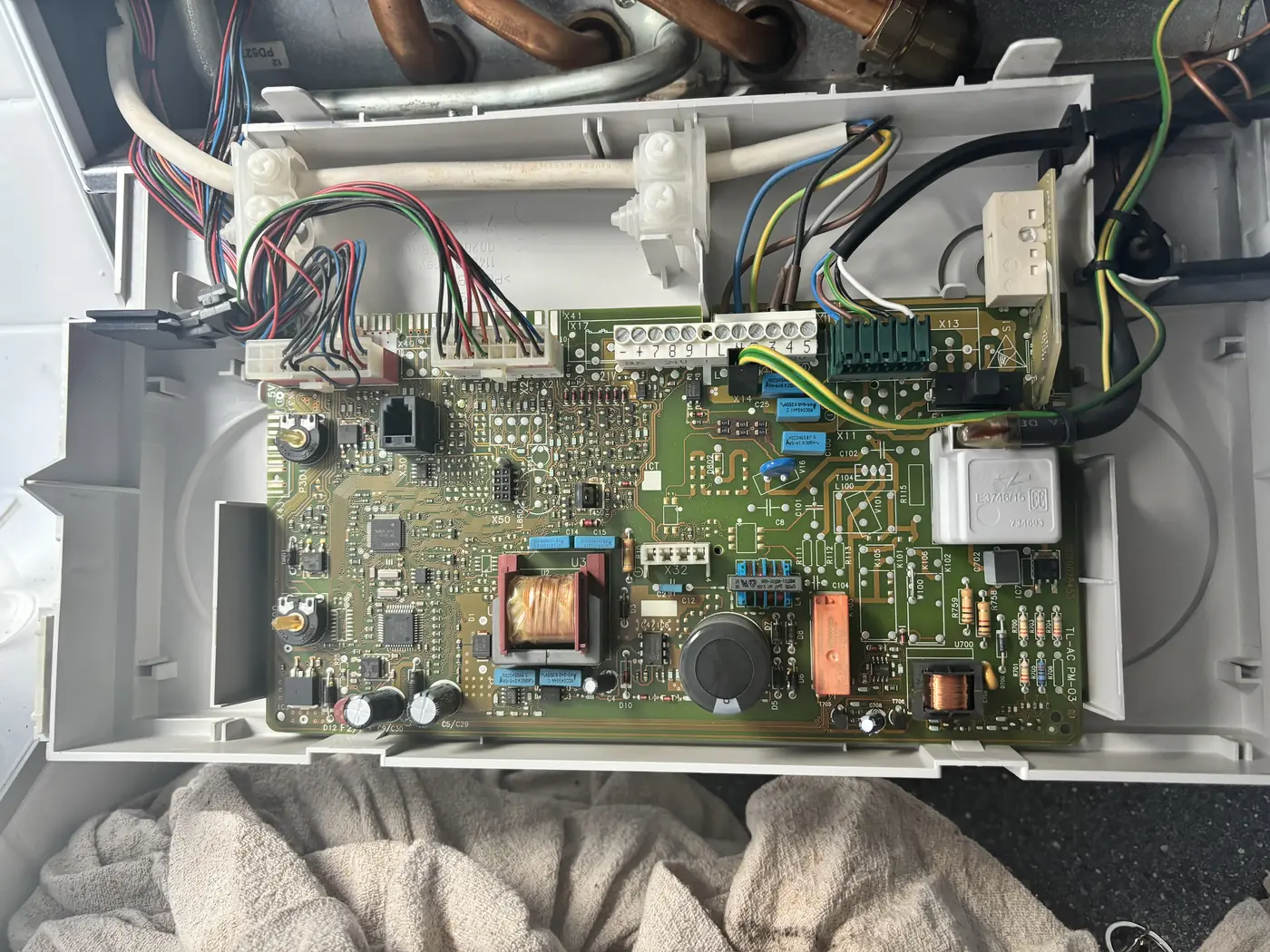 Boiler repair PCB circuit board replacement by heating engineer Bridgend