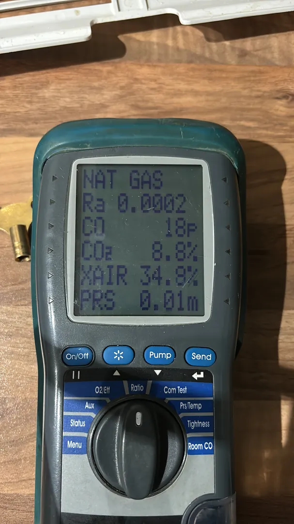 Gas Safe registered engineer performing gas analyser safety testing in Bridgend