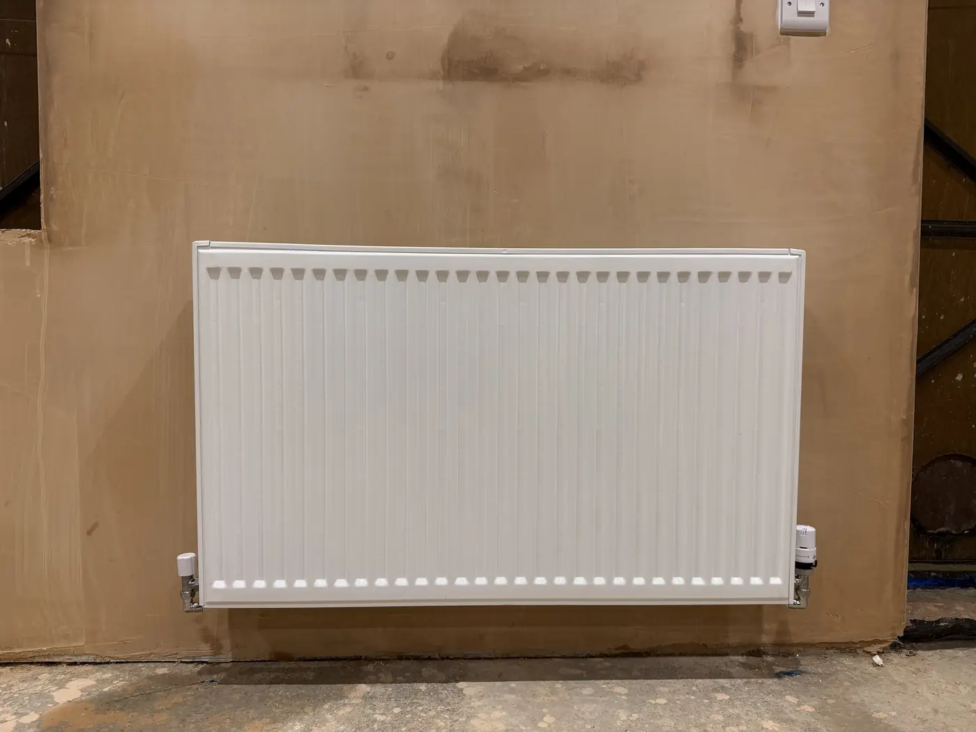 Panel radiator installation for commercial property by plumber in Cardiff