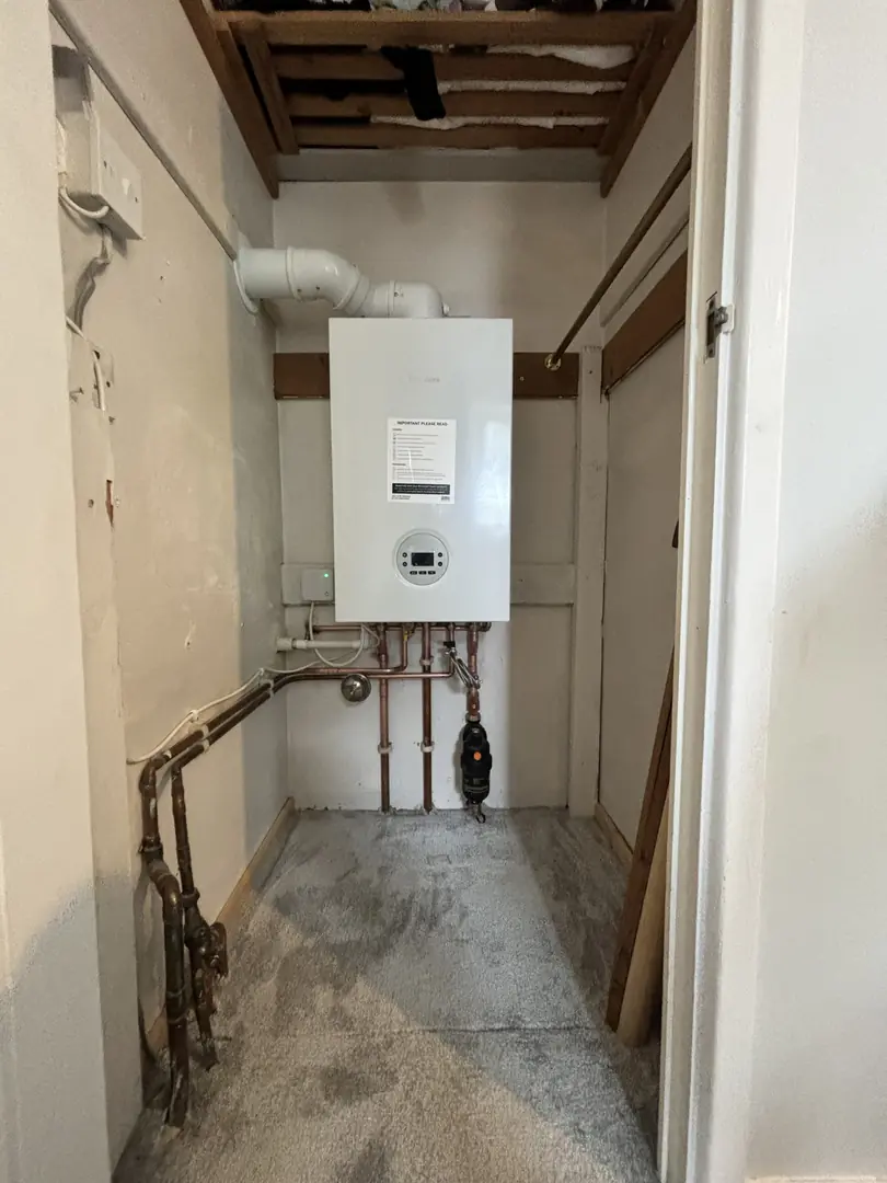 Worcester Bosch boiler installation in airing cupboard by heating engineer in Pyle