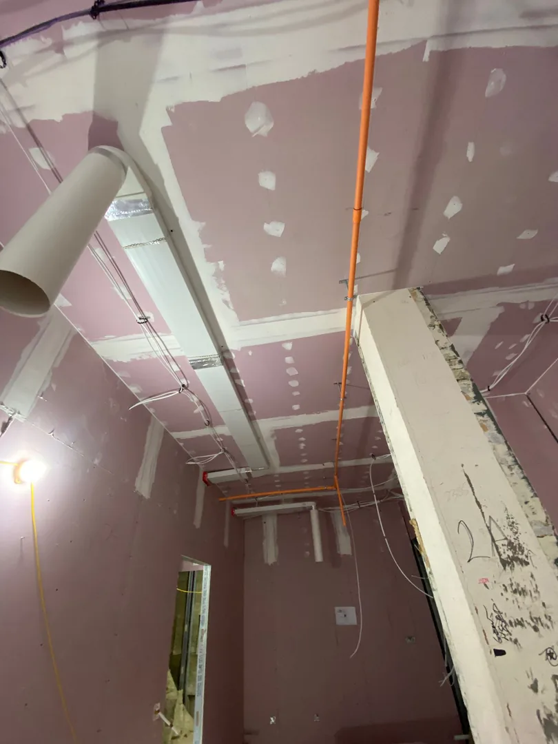 MVHR duct drops set out in plasterboard ceiling on a Port Talbot scheme