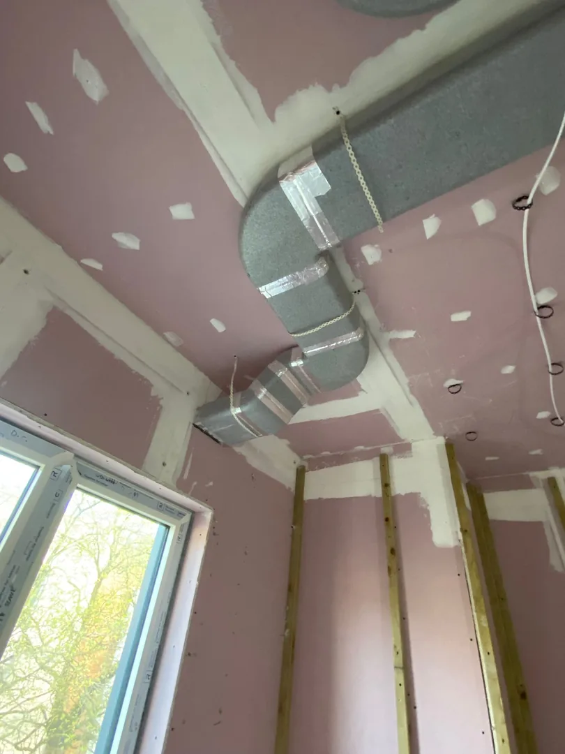 Neat MVHR duct elbow and branch installation in a Porthcawl ceiling void