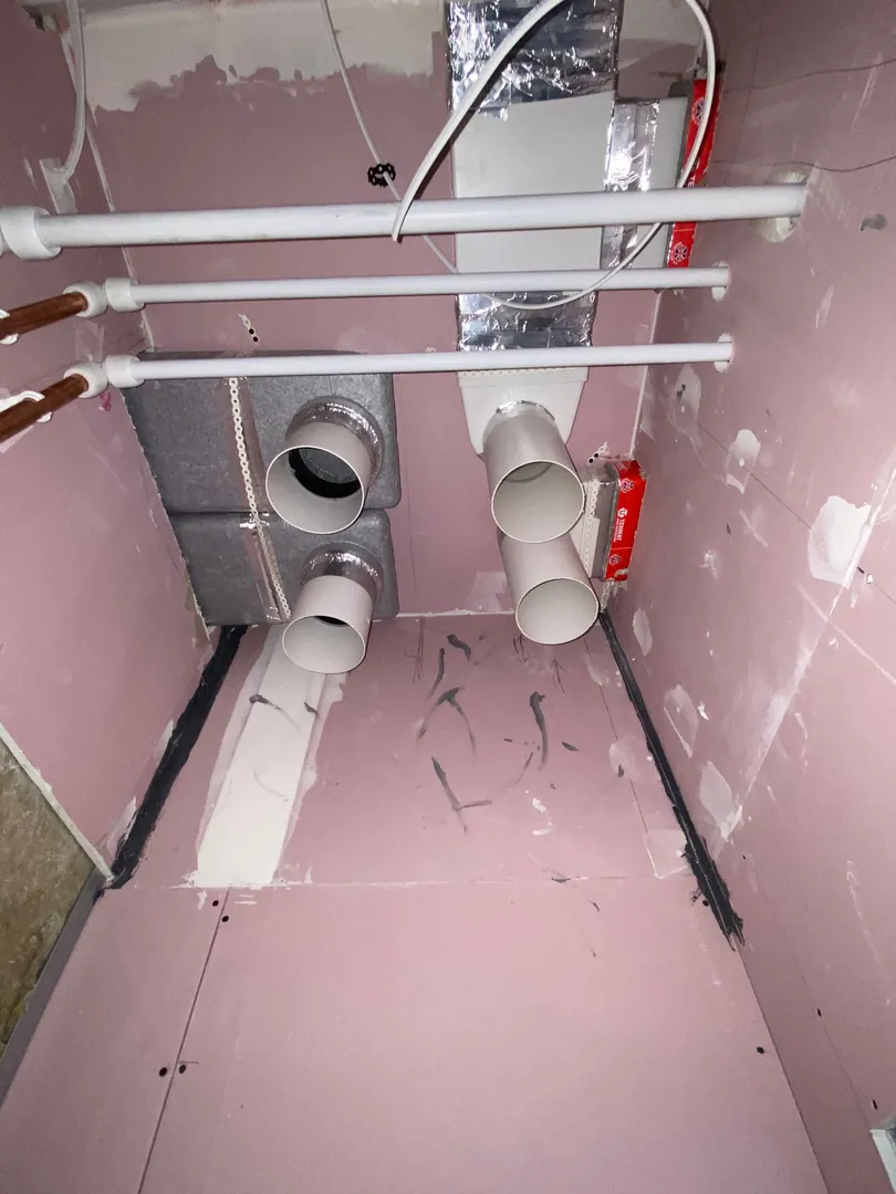 MVHR extract and supply ports with PVC duct connections on a Bridgend project